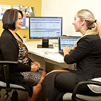 A woman consulting with an audiologist